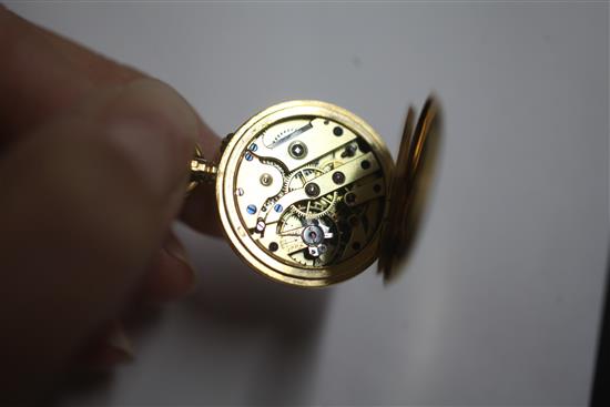 An early 20th century 18ct gold half hunter fob watch with a 15ct gold bracelet,